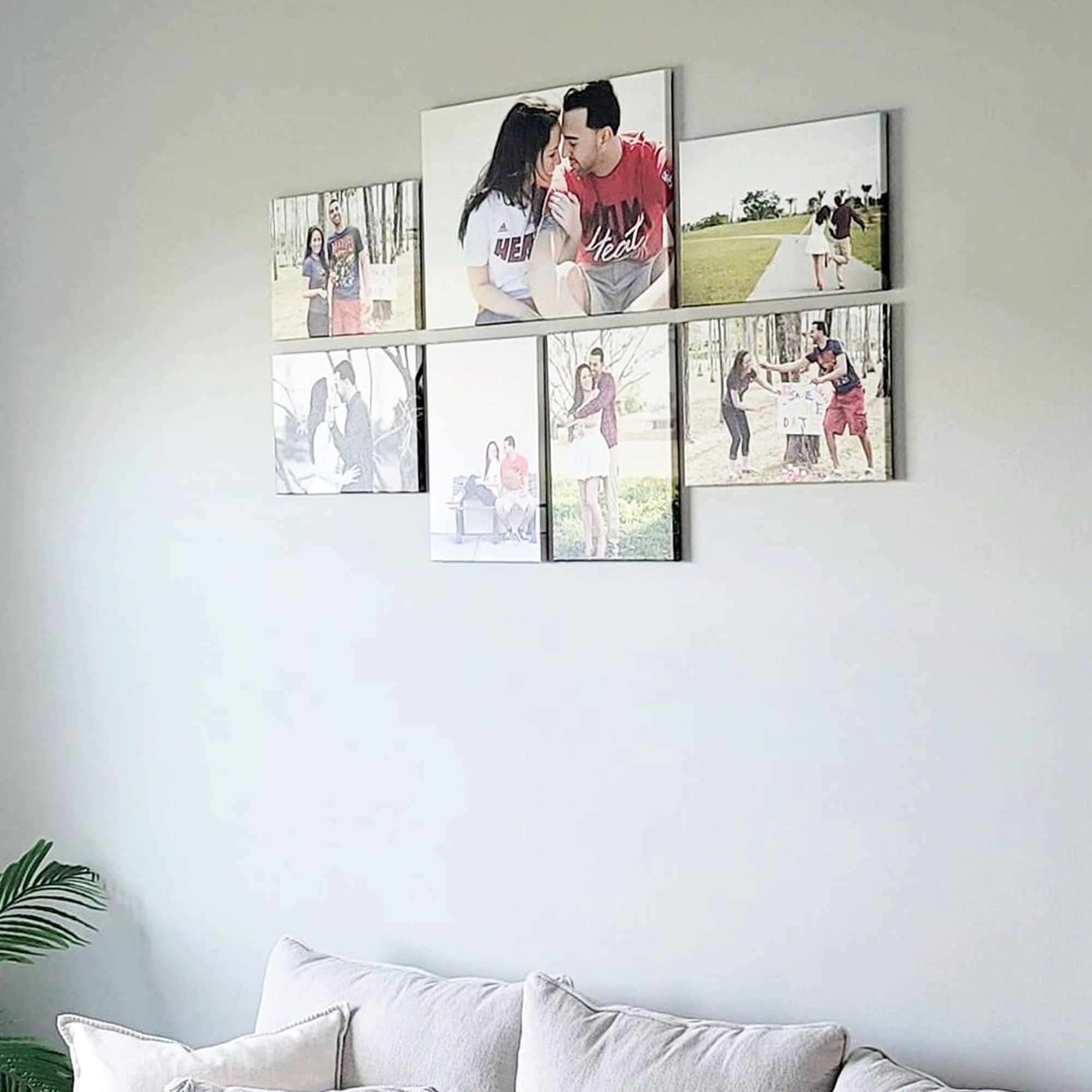 a seven piece photo gallery wall featuring a family photo shoot printed on canvas