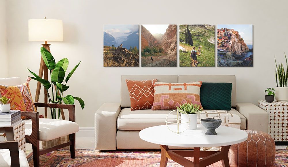 A full room view of four canvas prints of vacation adventures, hung on the wall of a home with a southwestern motive.   