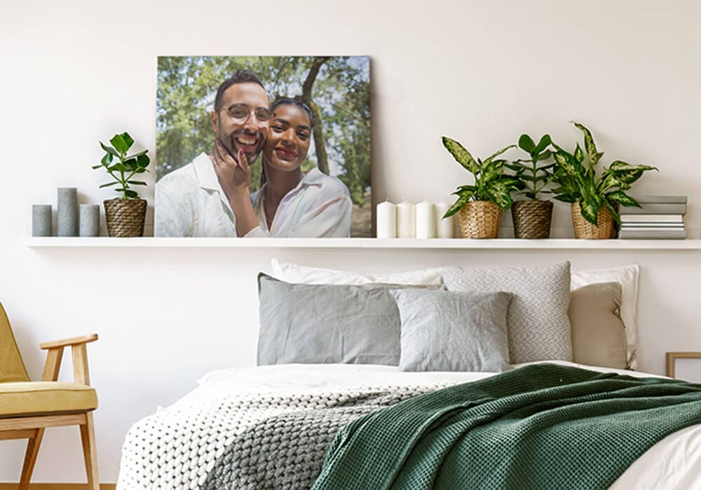 20x24 canvas print propped up on a shelf above a bed