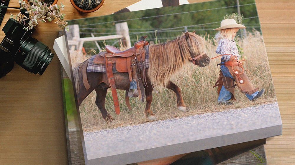 Stacked canvas prints with gallery-wrapped edges and matte texture displaying a photo on canvas