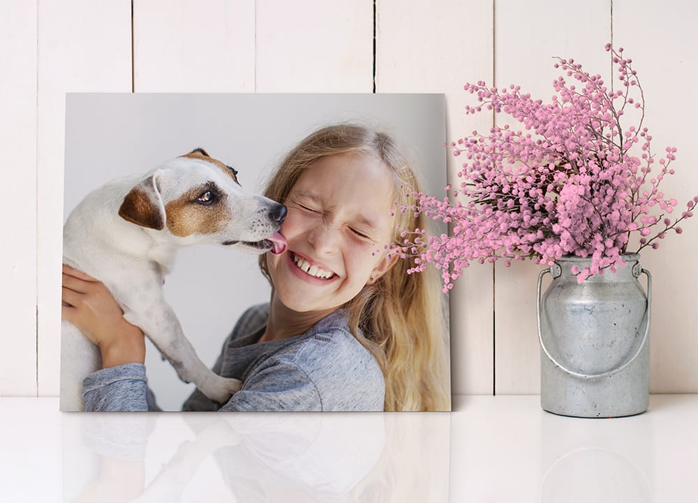 8x10 canvas print of a child and dog displayed next to home decor