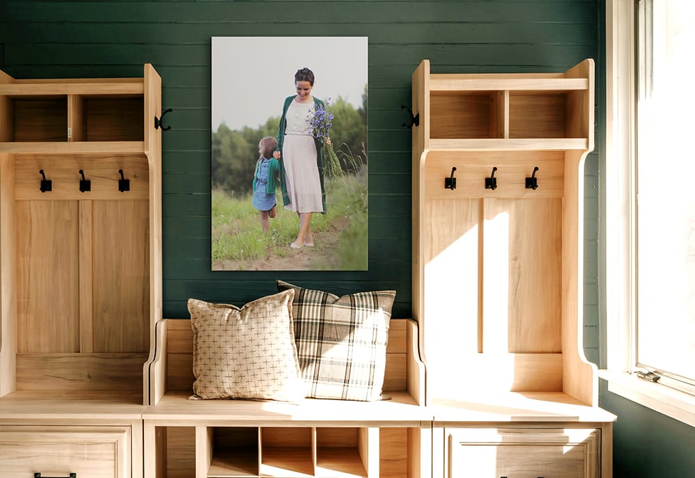 vertical canvas print of mother and child in entryway creating height and centering the focal point in the space.