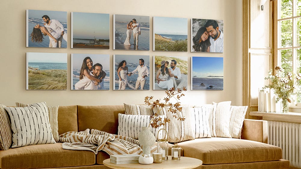 Ten square canvas prints arranged in two evenly spaced rows above a living room sofa.