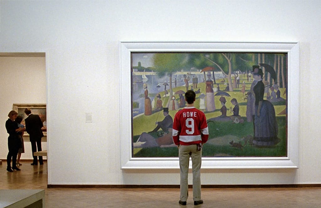 Cameron in front of the Seurat, the emotional core of Ferris Bueller's Day Off.