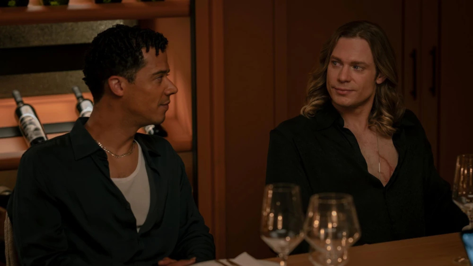 Louis and Lestat sitting side by side in episode six of The Vampire Lestat. Their outfits are discussed below.