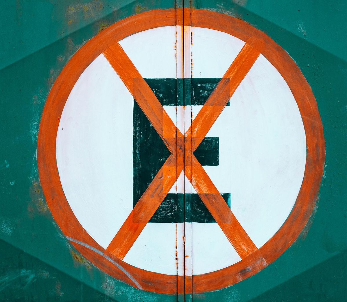 A red circle with a crossed-out black E in it