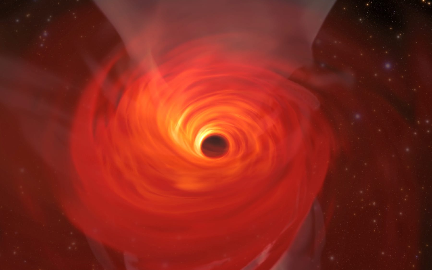 Simulated glowing gas around a black hole, distorted by gravitational lensing.