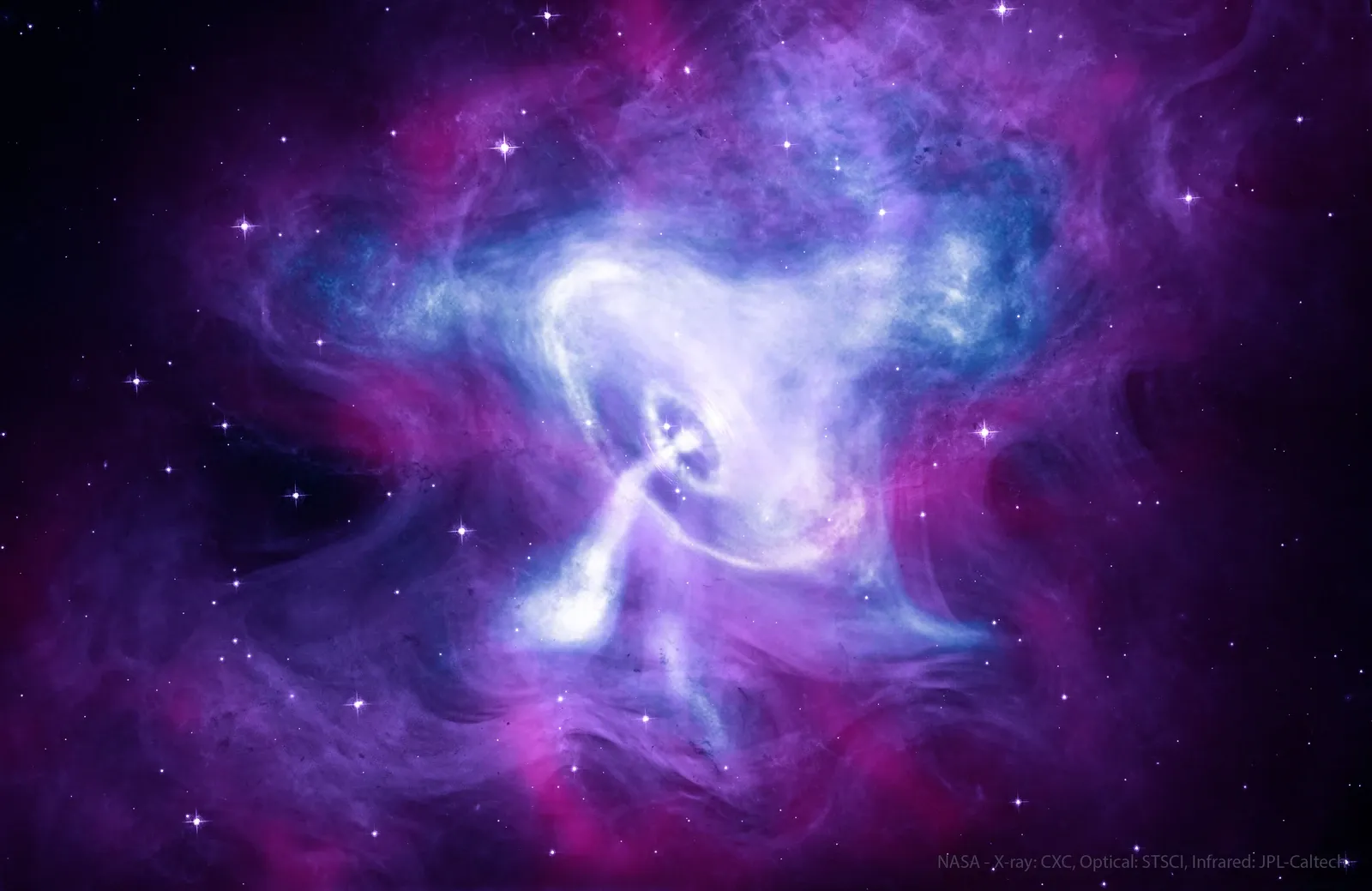 A bright pulsar sits within blue and purple swirling emission at the centre of the Crab Nebula.