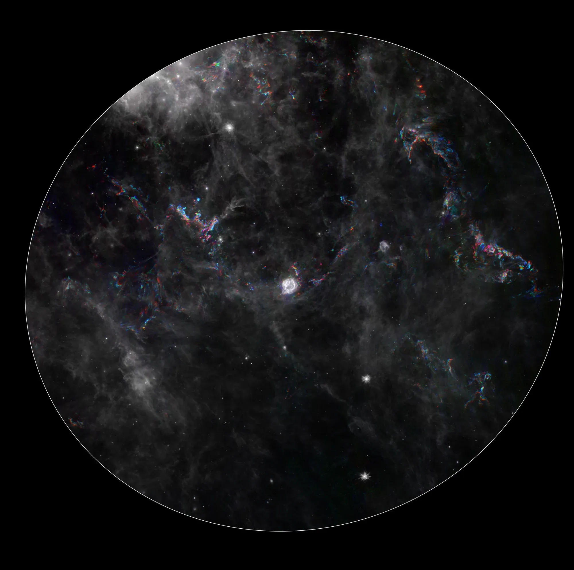 Spitzer composite of wispy interstellar dust around Cassiopeia A, with blue and orange traces marking changes in infrared emission at different observation times.