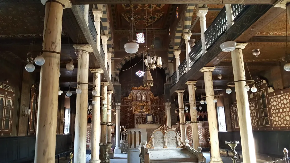 The Ben Ezra Synagogue interior with marble columns, balconies and an ornate ark