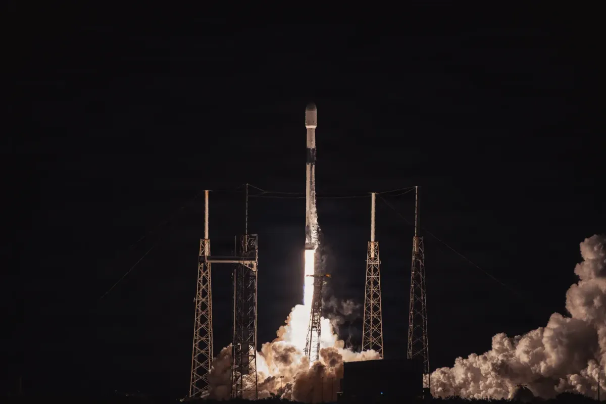 A Falcon 9 rises from its launchpad at night carrying the GPS III-SV09 satellite.