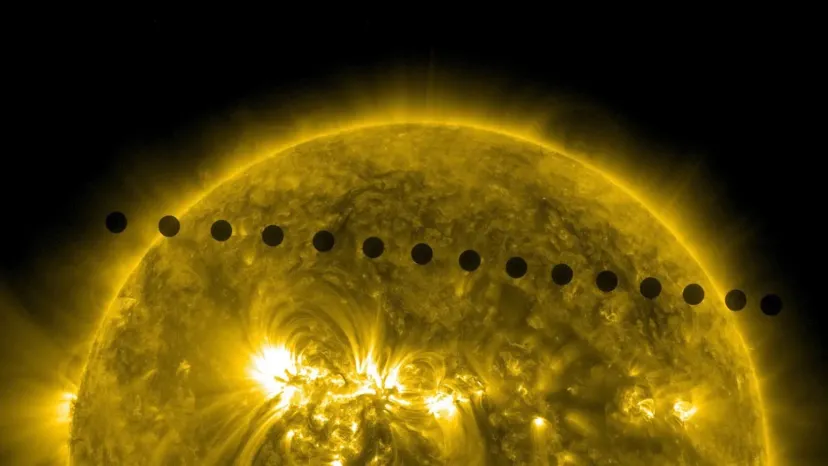 A series of dark silhouettes traces the path of Venus across the golden solar disk.