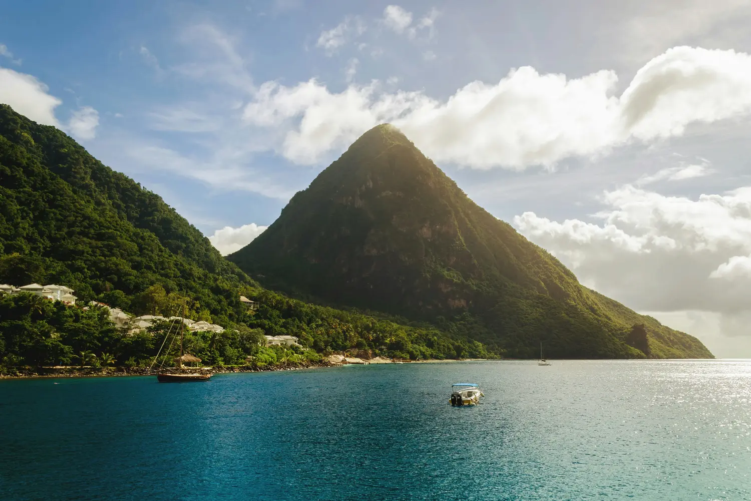 Gros Piton rising behind Sugar Beach on the southwest coast of Saint Lucia in the Caribbean