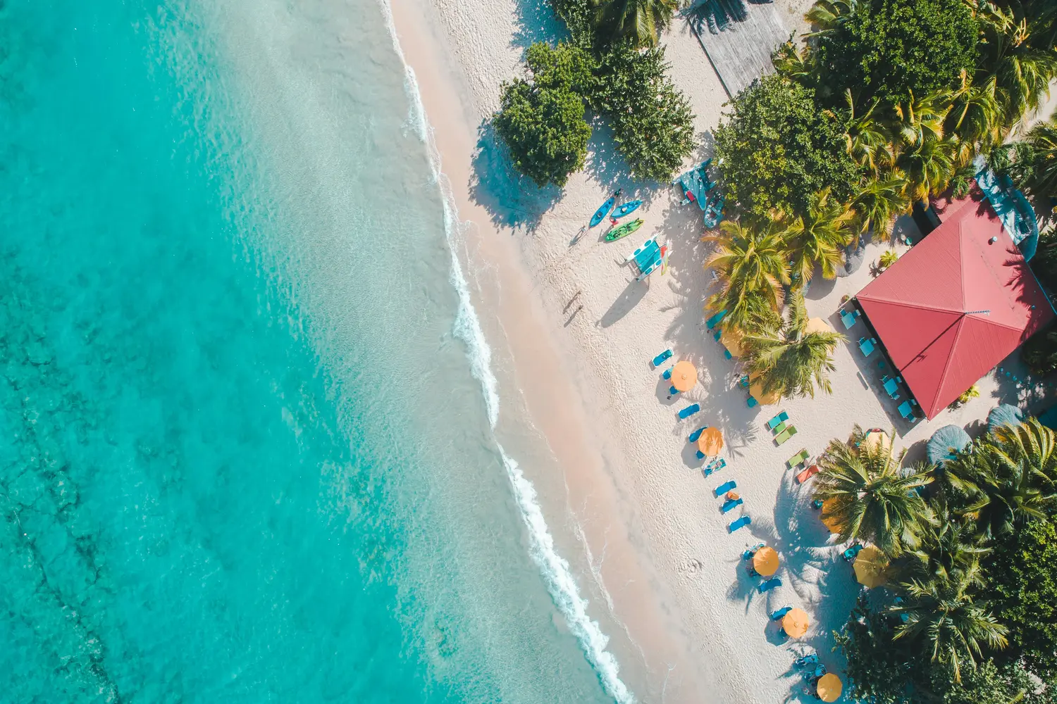 Tropical beach with turquoise water, & a sandy shore