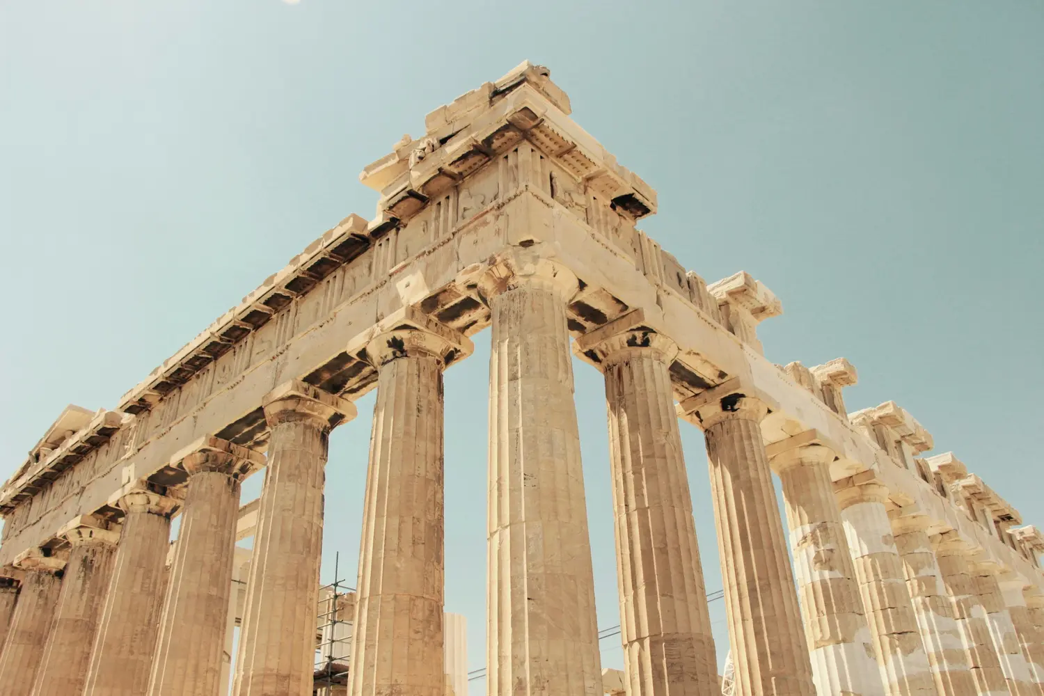 low-angle view of the Parthenon, an ancient temple dedicated to the goddess Athena on the Acropolis of Athens, Greece.