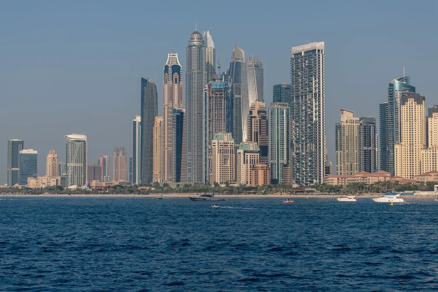 View of Dubai Marina's skyscrapers from the ocean during the day