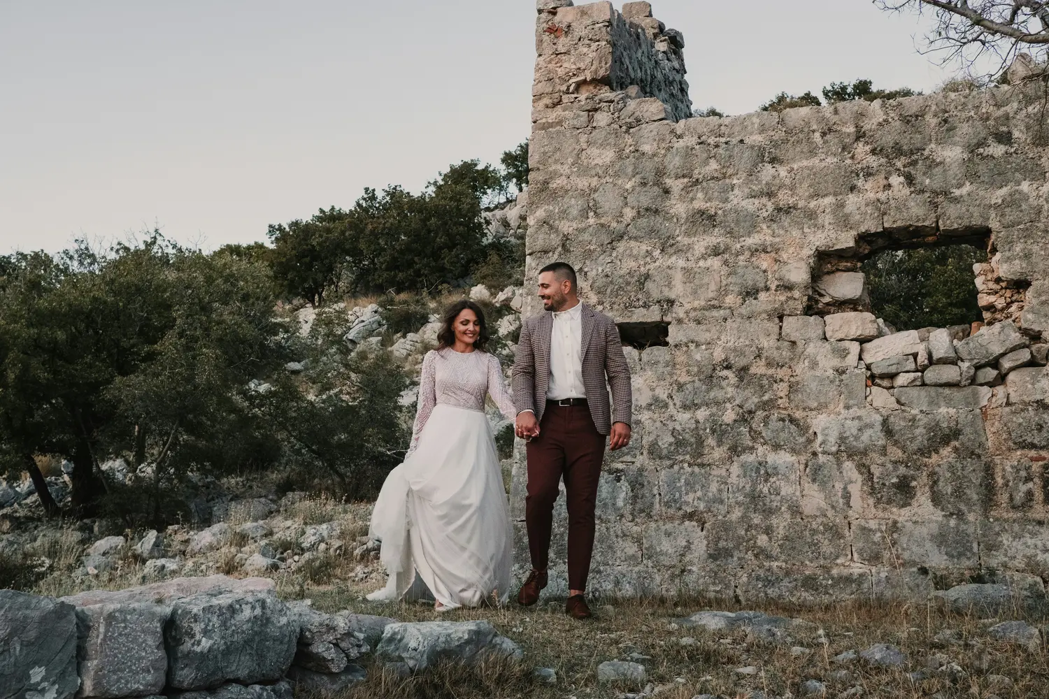 A Couple Walking Through the Ruins
