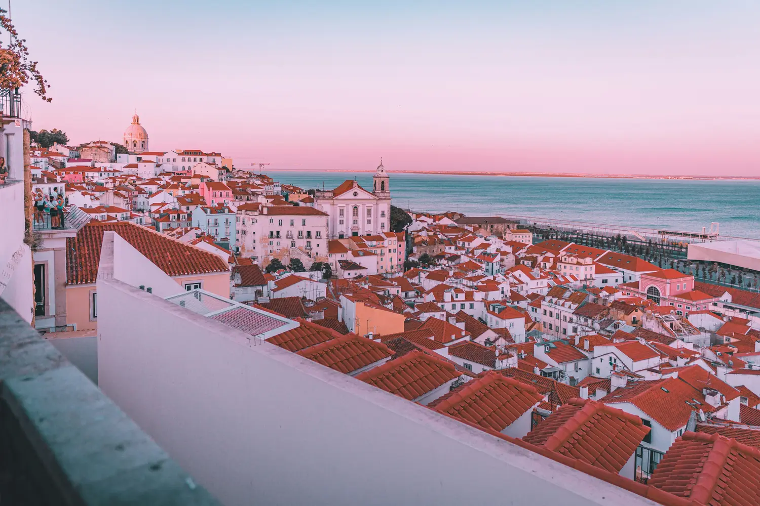Scenic rooftop view over the historic Alfama district, Tagus River in Lisbon, Portugal