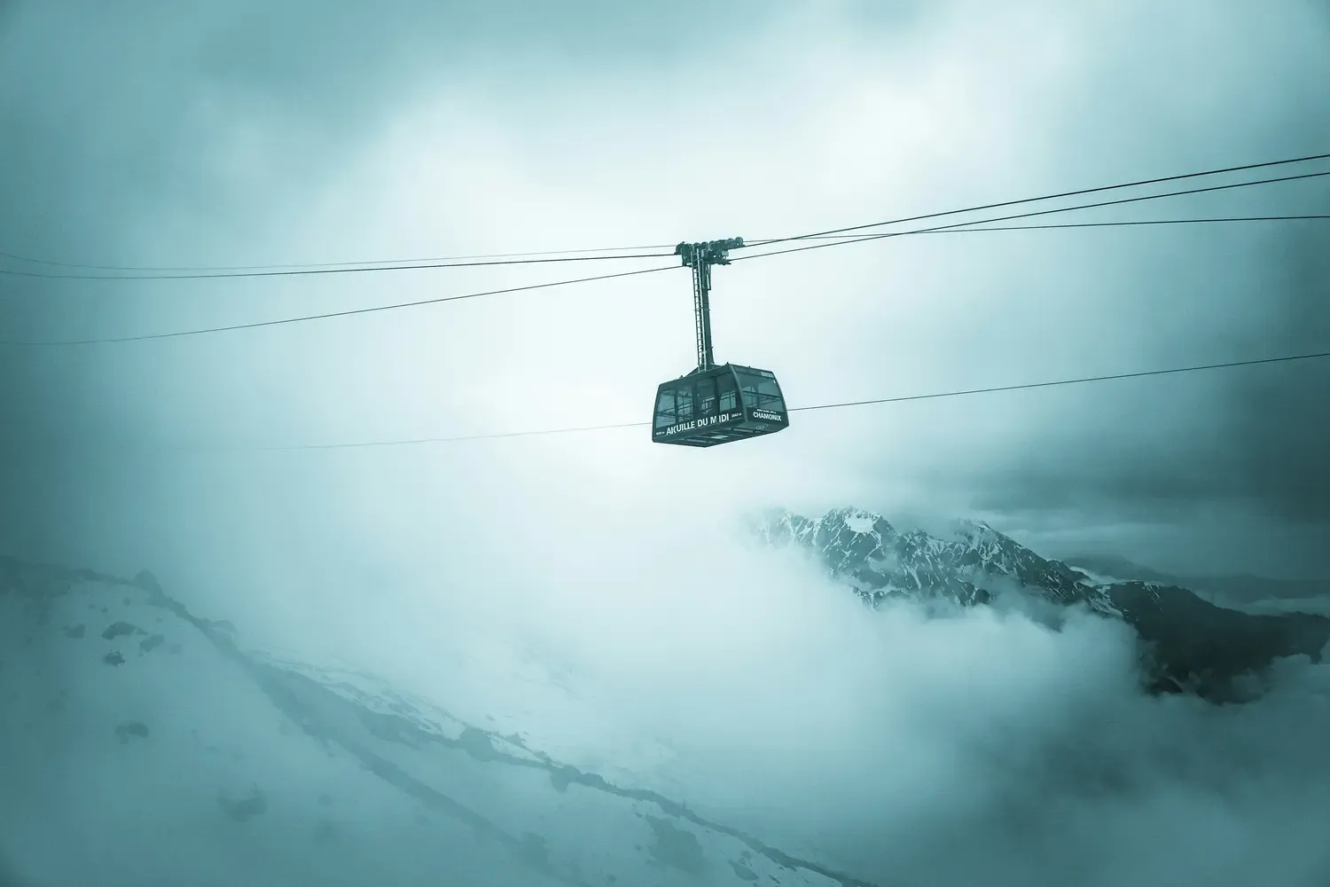 Cable car or aerial tramway, resembling the iconic Aiguille du Midi Cable Car in the Mont Blanc massif near Chamonix, France