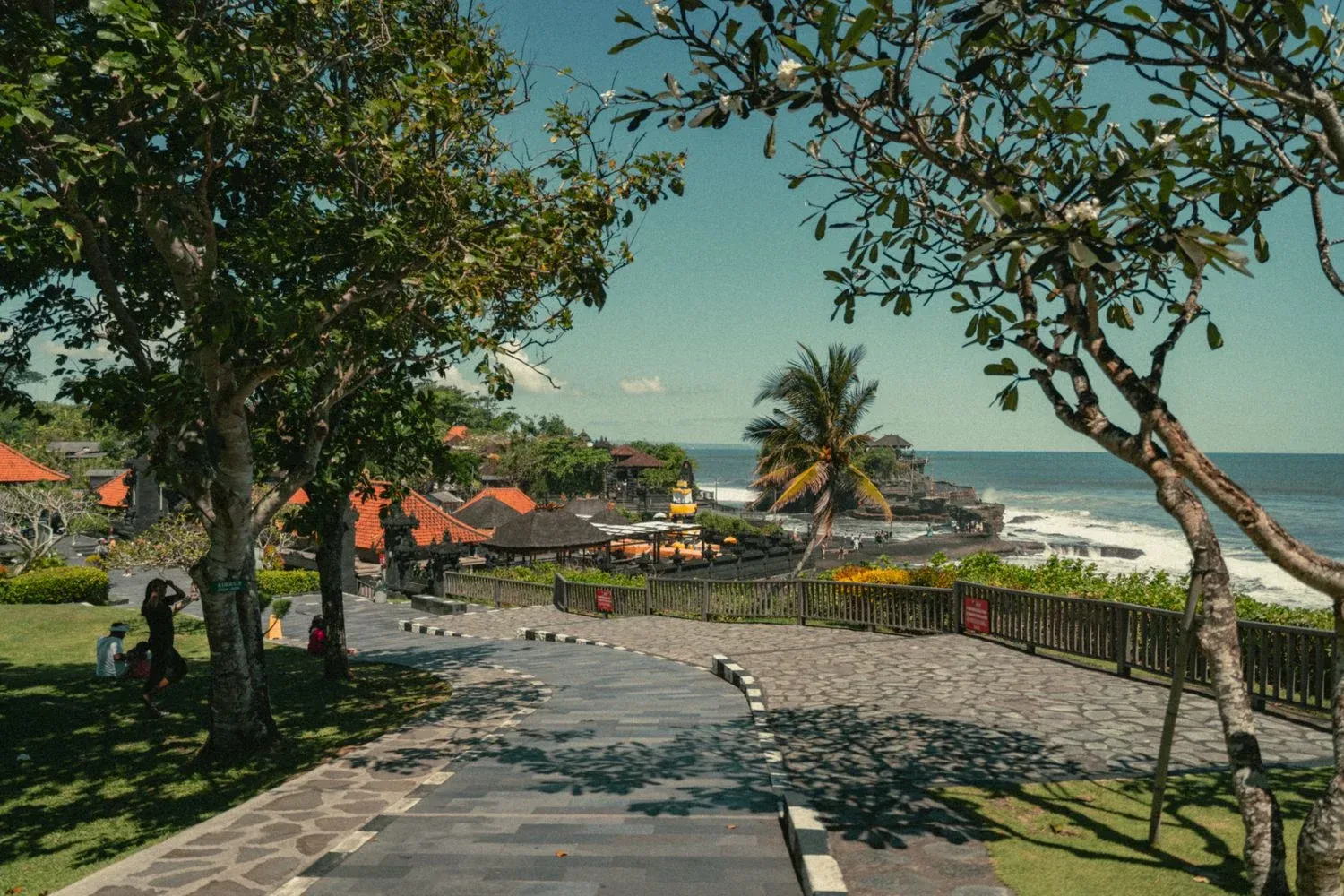 Tanah Lot Temple surrounded by trees and ocean in Bali, Indonesia