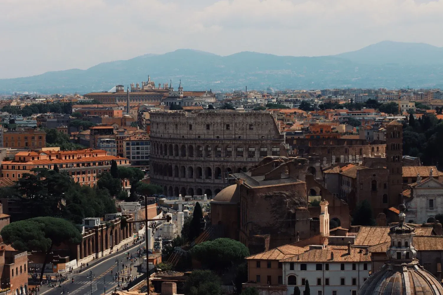 The iconic Colosseum and surrounding cityscape in Rome, Italy