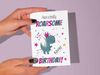 Printable fun dinosaur birthday card with quote, "Have a totally roarsome birthday!"