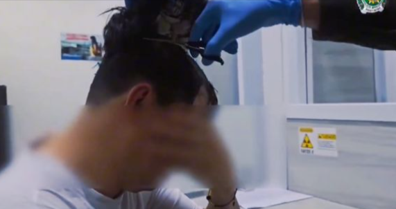 Police Notice Something Off About Man's Hair in Airport, Grab a Pair of Scissors, And Catch Him Red-Handed