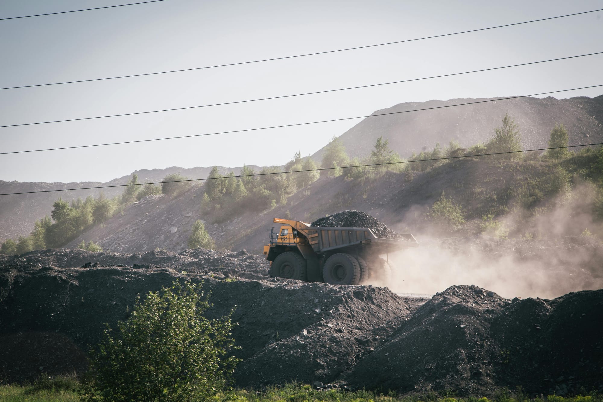 Truck Carrying Stones on Construction Site in Mountains