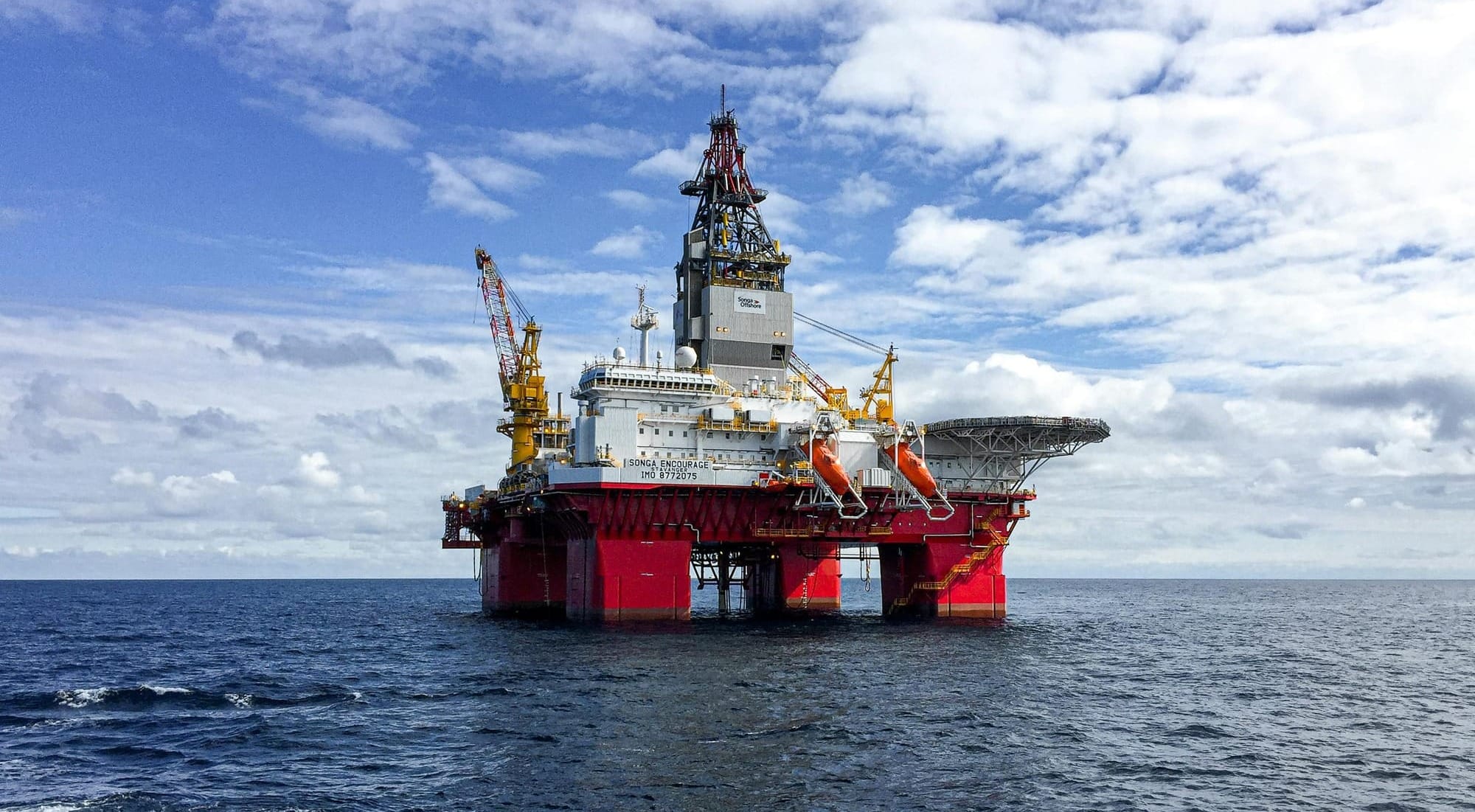Offshore oil platform under a bright sky in the North Sea