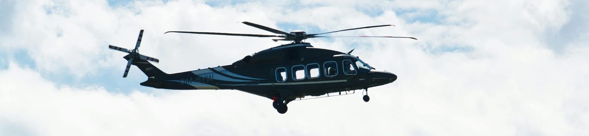 Traditional helicopter flying in sky