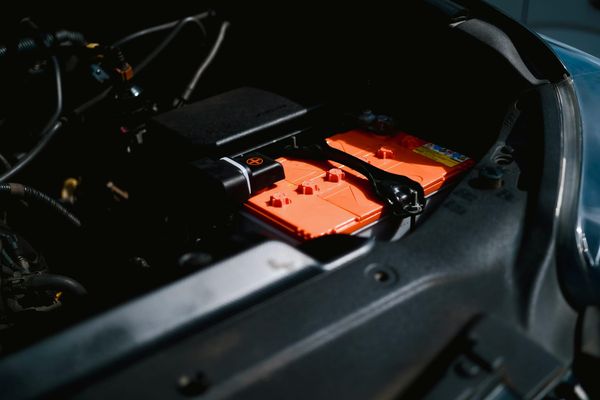 Electric car battery inside a vehicle's engine compartment