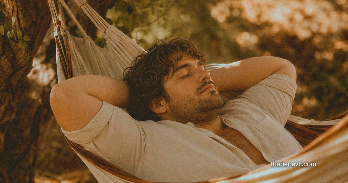 A person lying in a hammock with eyes closed, surrounded by soft natural light, in a state of genuine rest.