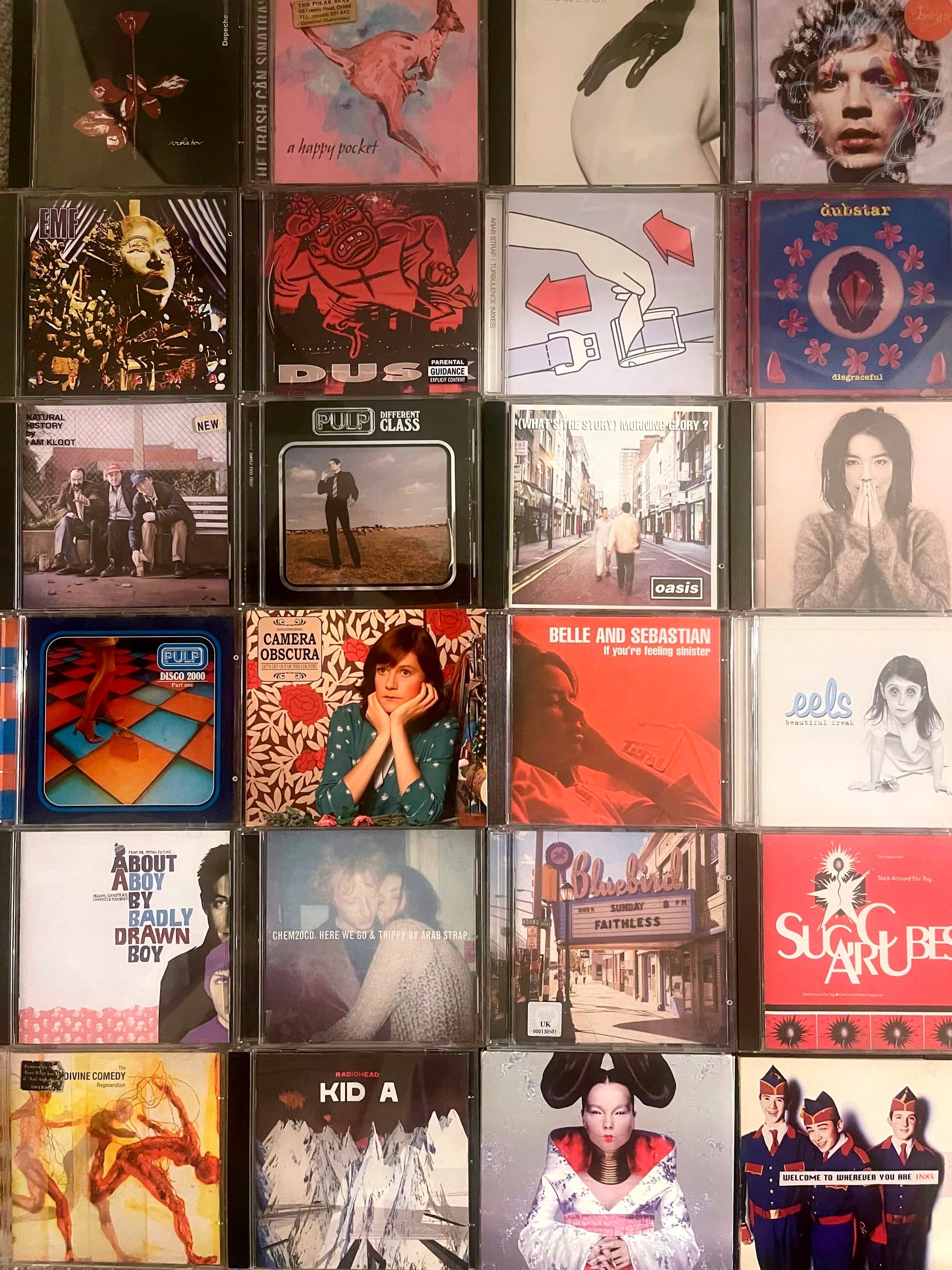 An image of (from l-r, top to bottom) the CD covers of: Violator, Depeche Mode; A Happy Pocket, The Trash Can Sinatras; Is This It?, The Strokes; Sea Change, Beck; Stigma, EMF; Dusk, The The; Turbulence (mixes), Arab Strap; Disgraceful, Dubstar; Natural History, I Am Kloot; Different Class, Pulp; (What's the story) Morning Glory?, Oasis; Debut, Björk; Disco 2000, Pulp; Let's Get Out of This Country, Camera Obscura; If you're feeling sinister, Belle and Sebastian; Beautiful Freak, Eels; About a Boy, Badly Drawn Boy; Here We Go, Arab Strap; Sunday 8pm, Faithless; Stick Around For Joy, Sugercubes; Regeneration, The Divine Comedy; Kid A, Radiohead; Homogenic, Björk; Welcome to wherever you are, INXS. 
