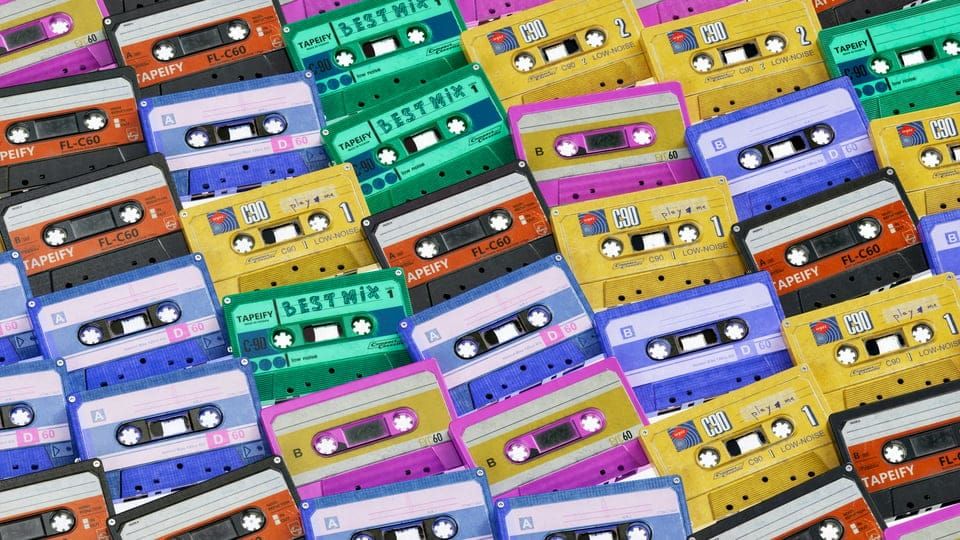 A range of different coloured cassette tapes.