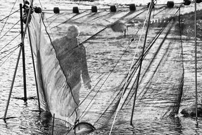 THROUGH THE VEIL OF A FISHING NET, C