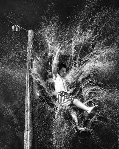 Shannon Mountford captured the flag in the greasy pole contest in Eastport. (photo by Don Dunbar)