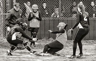 SAFE! Ieishia Mitchell of Shead slides safely into home plate during a May 8 high school softball game against Machias. The Lady Bulldogs defeated the Tigerette