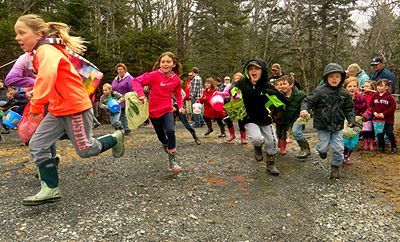 AND THEY'RE OFF -- FINALLY! Youngsters run to collect over 5,000 eggs at Herring Cove Provincial Park during the annual Community Easter Egg Hunt on Campobello. The egg hunt was postponed un