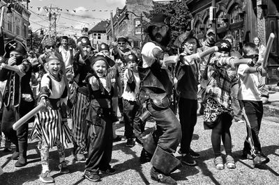 GIVING A LOUD HUZZAH! after finishing their training were these youths during the Eastport Pirate Festival. They then charged the pirates at the Battle at Bank Square to take over the town. 