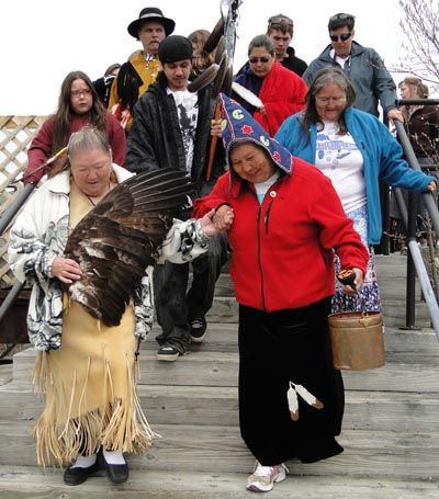 A PAIL OF WATER gathered from the Atlantic Ocean at the Picture Rock petroglyph site in Machiasport is carried to a ceremony at Bad Little Falls, Machias, by Josephine Mandamin of the Ojibwa