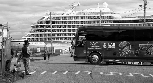 WAITING FOR VISITORS from the Viking Mars cruise ship to stop by his vintage hat shop in downtown Eastport is Jim Blankman. (Edward French photo)