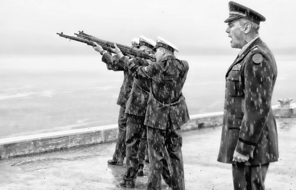 'FIRE!' During a sharp rain, a three-volley salute is fired under the direction of retired U.S. Army Lt. Colonel Andrew Pottle by personnel from U.S. Coast Guard Station Eastport at the East