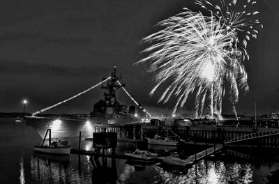 FIREWORKS light the sky over the destroyer U.S.S. Jason Dunham during Eastport’s Fourth of July celebration.
