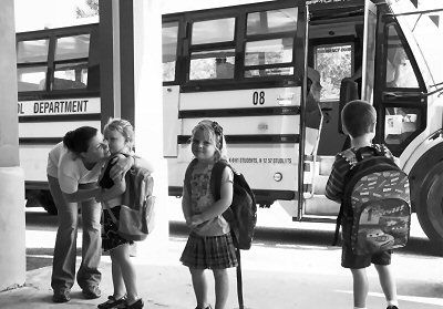 FIRST DAY OF SCHOOL. On September 1, Melissa Critchley gives a goodbye hug to her daughter Brenna (at left), who is entering K4 at the Eastport Elementary School, along with Audrey Andrews (