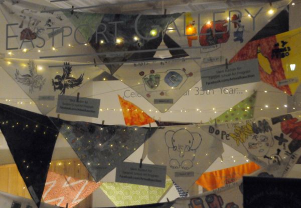 COLORFUL BANDANNAS, hand-painted by Eastport students in grades 3'8, are on display in the windows of the Eastport Gallery. A silent auction to benefit the Eastport schools' art program is o