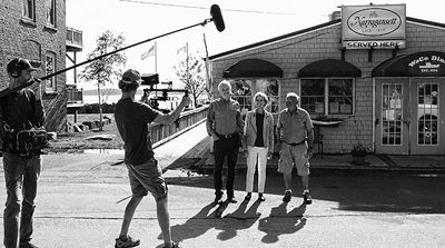 A DOCUMENTARY CREW for an HBO production films James and Deborah Fallows, authors of the Our Towns book,interviewing Bob Delpapa in front of his restaurant, the WaCo Diner. (Edward French ph