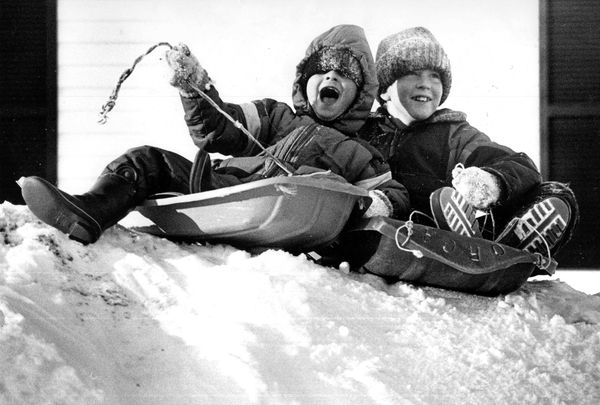 SLEDDING DOWN A HILL in Lubec during a snowy winter in 1990 are Jason Marston and Shaun Paige. Both sledding and skating were among the popular winter pursuits during past winters in the are