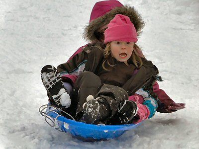 IEEEEEEEEE! Ashlyn Dinsmore of Lubec gives a yelp of concern as she spins with her friends towards the bottom of the hill during a recent fun outing in the snow. (Chessie Crowe Gartmayer pho