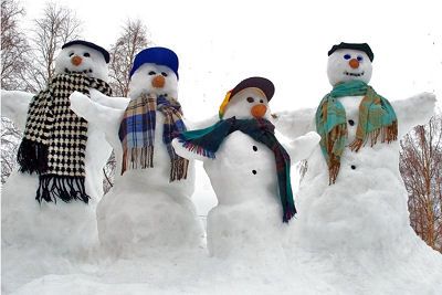 THESE FOUR STYLISH SNOWMEN have fun hanging out in their front yard in Whiting, wishing for more snow to come. Let it snow, let it snow, let it snow! (Chessie Crowe photo)