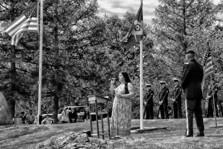 SINGING a moving version of 'Amazing Grace,' with words both in Passamaquoddy and English, is Taina Francis-Mendez, during the Memorial Day ceremony at the Hillside Cemetery in Eastport. See